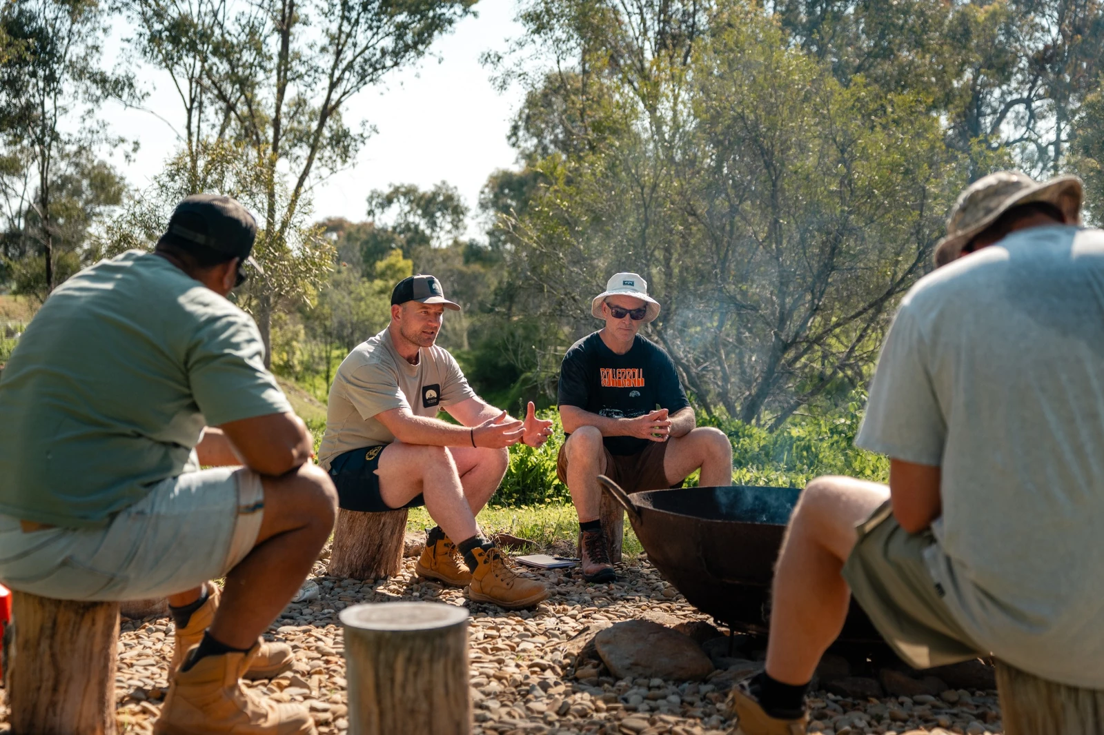 Arran listens as men share around a fire